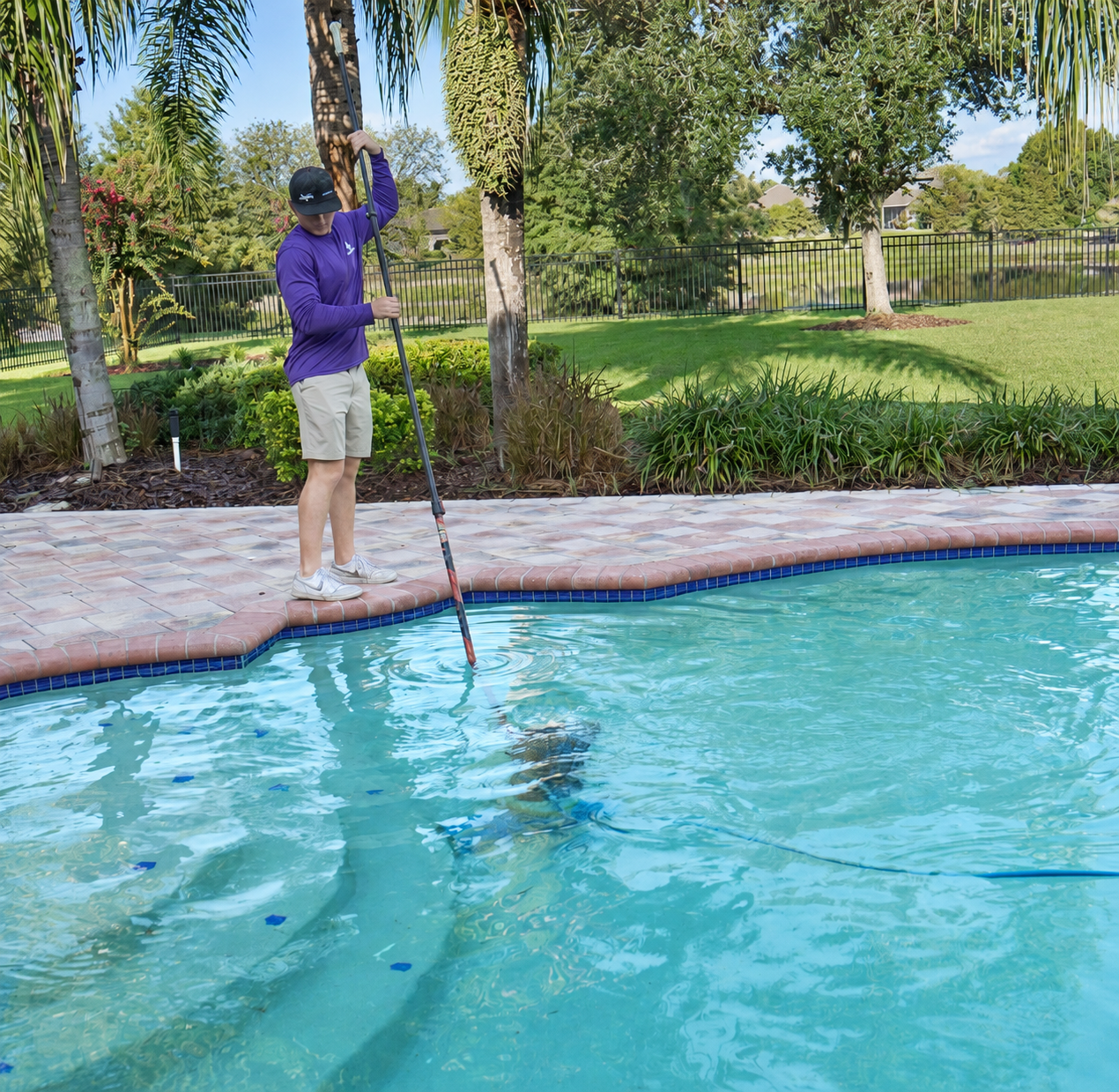 WTR DR technician servicing a residential pool at a Land O' Lakes home