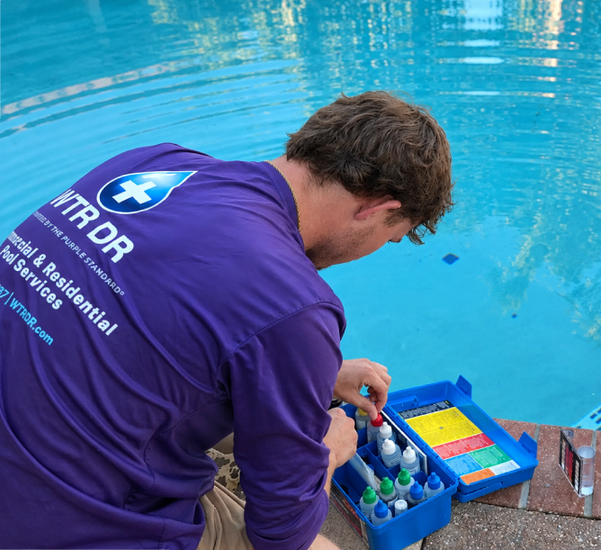 WTR DR cleaning and servicing a residential pool